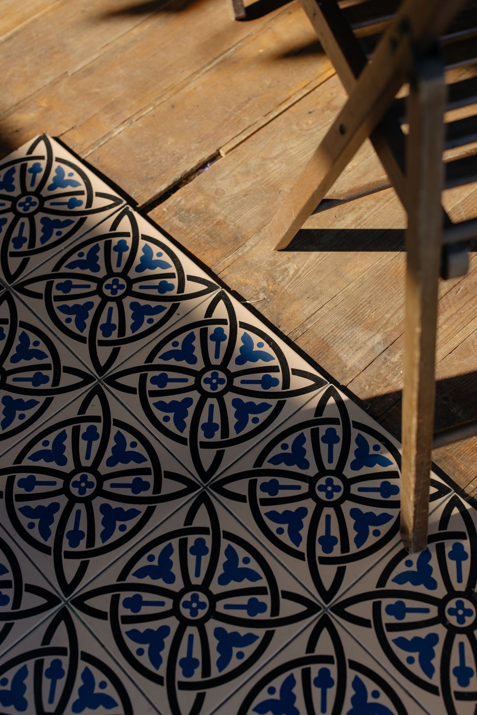 Decorative tile meeting warm wood planks
